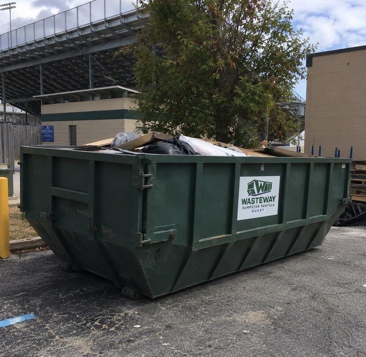 Loaded roll-off dumpster from Wasteway at a worksite